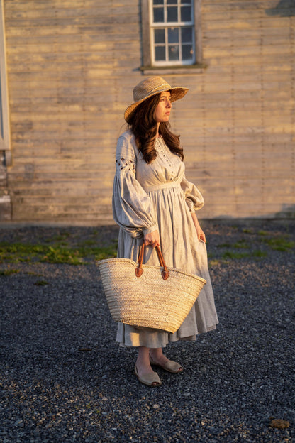 Meg March linen dress with puffy sleeves, with straw hat and bag