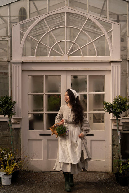 Meg March linen dress with puffy sleeves, with white linen half apron