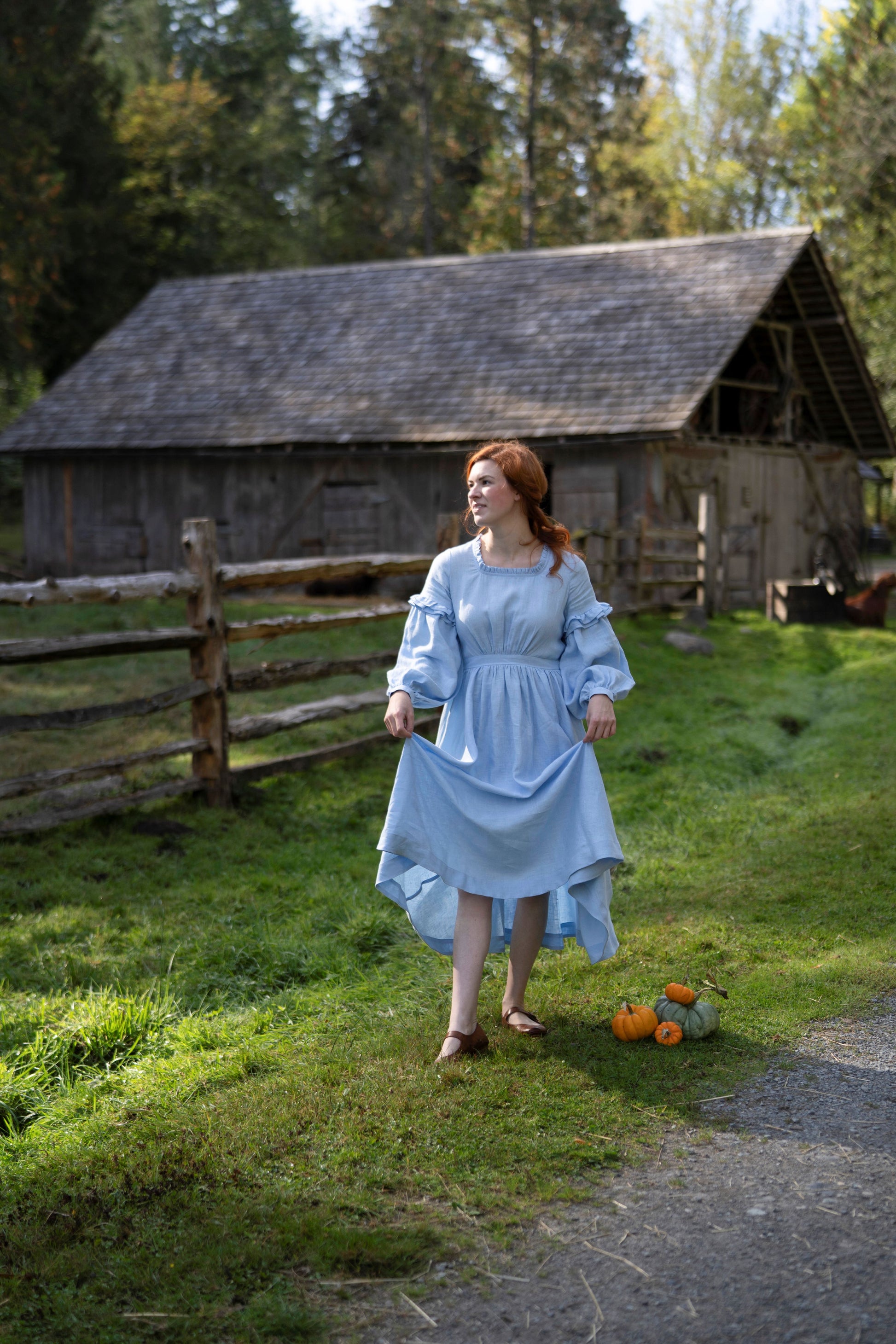 Ella Linen Dress in sky blue. 
- Fabric: 100% medium weight linen (190 g), Oeko-Tex Standard 100 certified
- Ruffled neckline
- Puffed sleeves
- Flared skirt
- Rear zip fastening
- Lacing on the back
- 2 side seam pockets
- Midi length