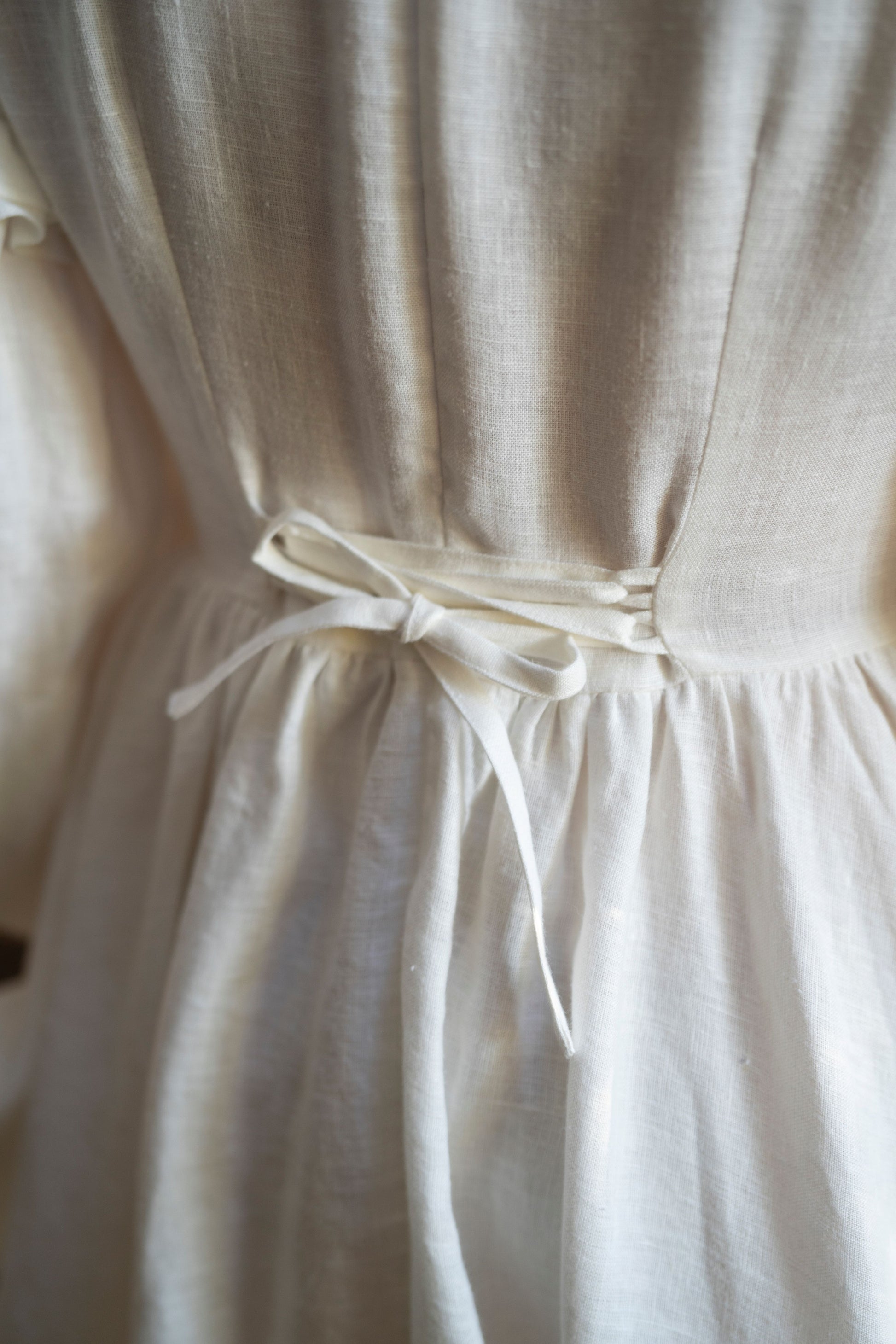 Ella linen dress in white for women.
New collection of LWA and UnderARinRoof. New linen clothes, linen vests, linen boustier, linen chemise, pocket, scarf.
Back tie