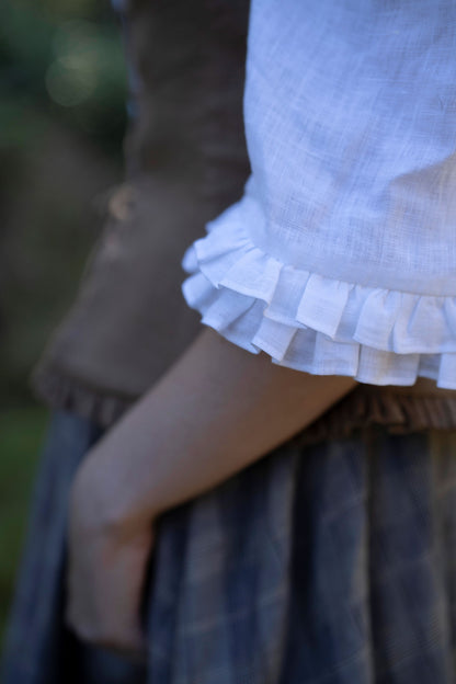 Fiona linen chemise in snow shite. Plaid Skirt, Chocolate bustier.